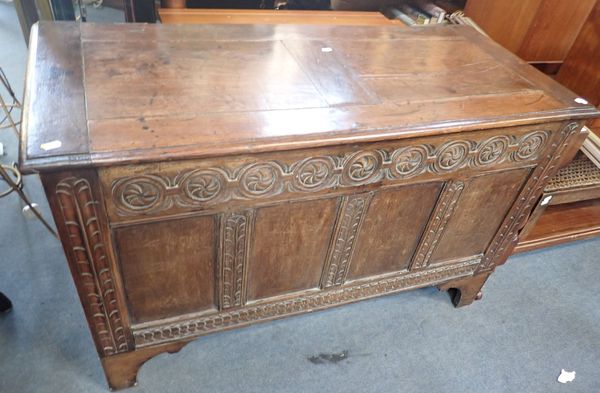 AN OAK COFFER, WITH CARVED RAILS