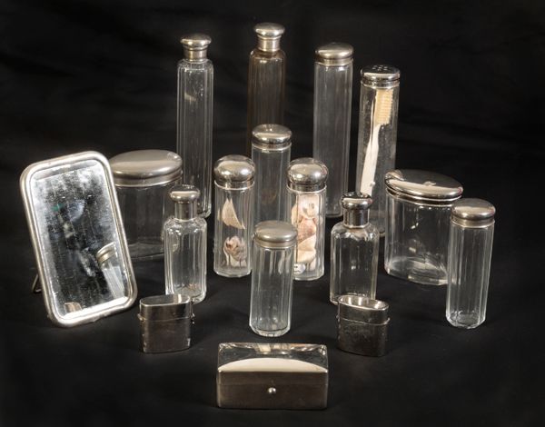A COLLECTION OF THIRTEEN SILVER PLATED DRESSING BOTTLES