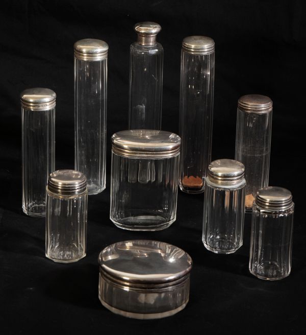 A COLLECTION OF TEN SILVER DRESSING BOTTLES