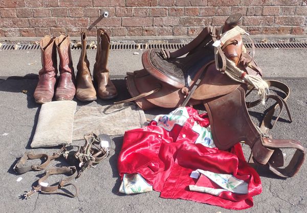 A WESTERN STYLE LEATHER SADDLE, BOOTS, SPURS