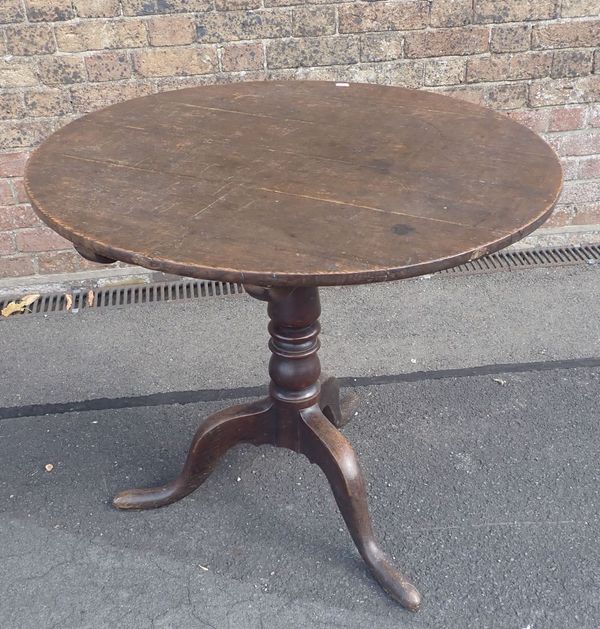 A GEORGE III OAK TRIPOD TILT TOP TABLE