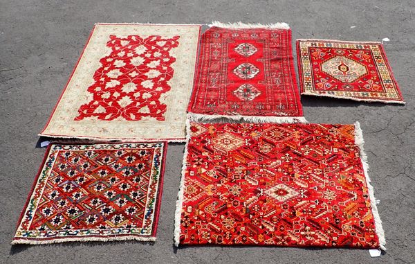 FIVE RED GROUND RUGS