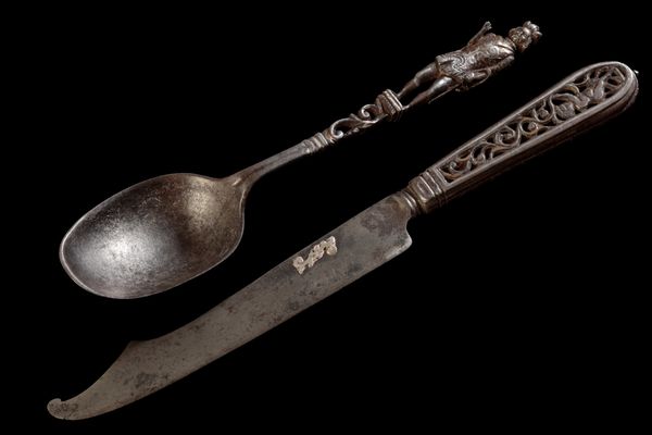 A NORTH EUROPEAN STEEL AND PARCEL-GILT KNIFE AND SPOON
