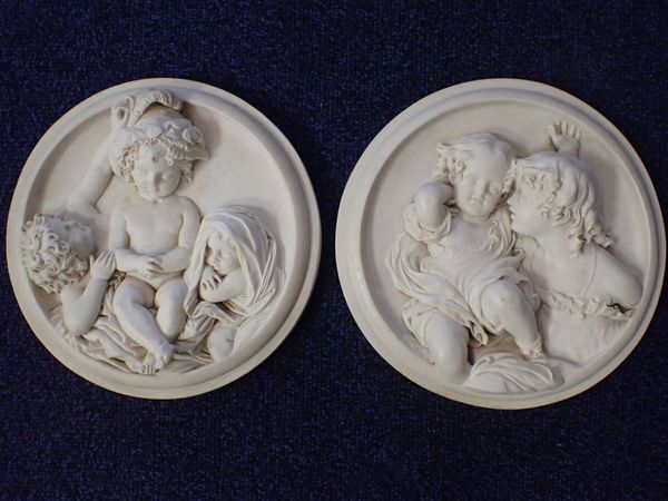 A PAIR OF CLASSICAL STYLE RESIN ROUNDELS
