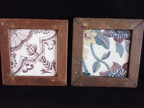 A MANGANESE DECORATED CERAMIC TILE, AND ANOTHER SIMILAR