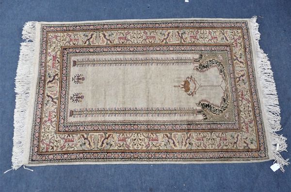 A CREAM GROUND PRAYER RUG