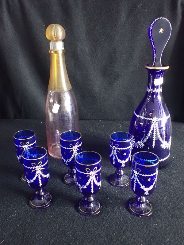 A BLUE DECANTER AND SIX GLASSES