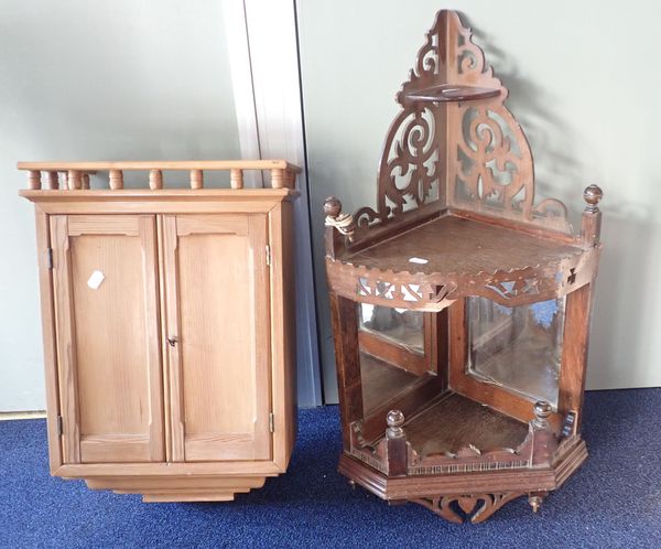 A SMALL STRIPPED PINE CUPBOARD