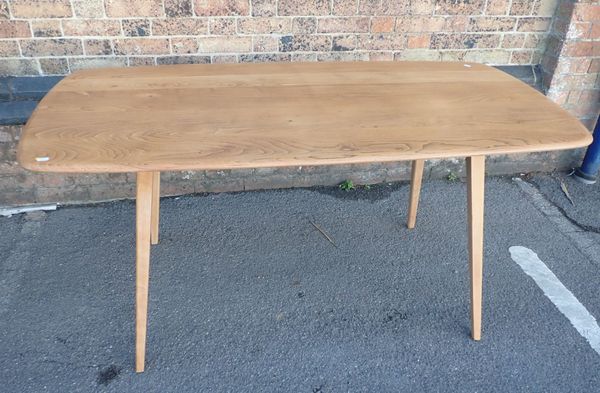 ERCOL: A  BLOND ELM DINING TABLE
