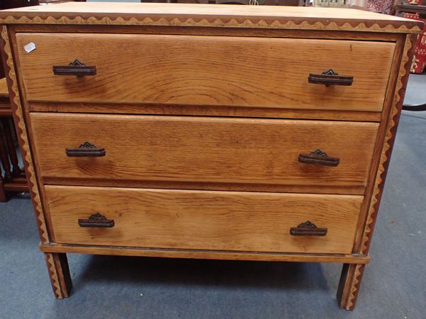 AN  OAK ART DECO CHEST OF DRAWERS  WITH BAKELITE HANDLES