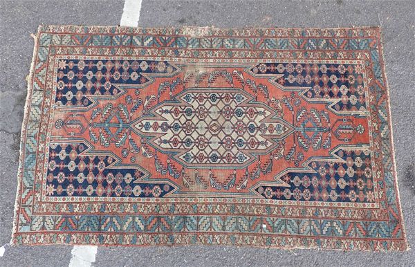 AN ANTIQUE MAZLAGHAN RUG