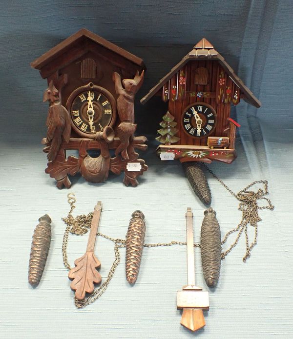 TWO CUCKOO CLOCKS, ONE OF TYPICAL 'BLACK FOREST' TYPE