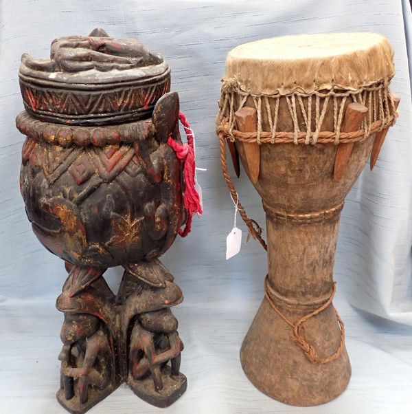 AN AFRICAN CARVED WOOD LIDDED URN