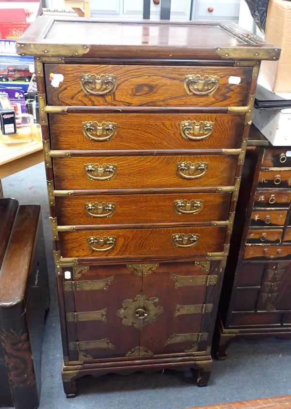 A CHINESE BRASS MOUNTED ELM FINISH CHEST OF DRAWERS