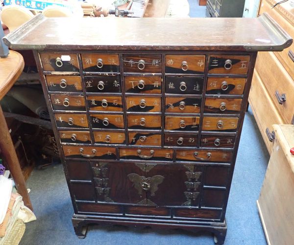 A CHINESE ELM FINISH MULTI DRAWER CHEST