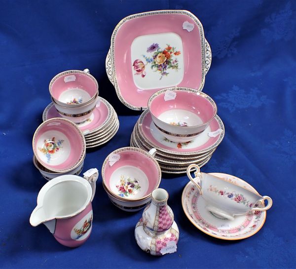 A TEA SERVICE FOR SIX , WITH FLOWERS WITHIN A PINK BORDER