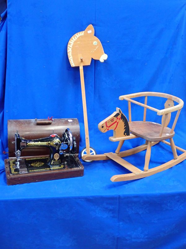 A CHILD'S ROCKING CHAIR WITH HORSE HEAD