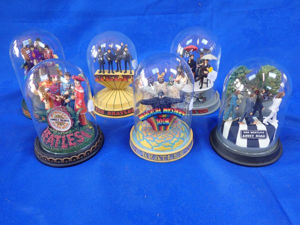 THE BEATLES: SIX FRANKLIN MINT DECORATIVE FIGURES BENEATH GLASS DOMES