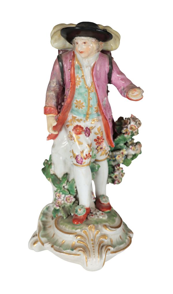 AN 18TH CENTURY DUESBURY & CO DERBY PORCELAIN FIGURE - 'THE MAP SELLER'