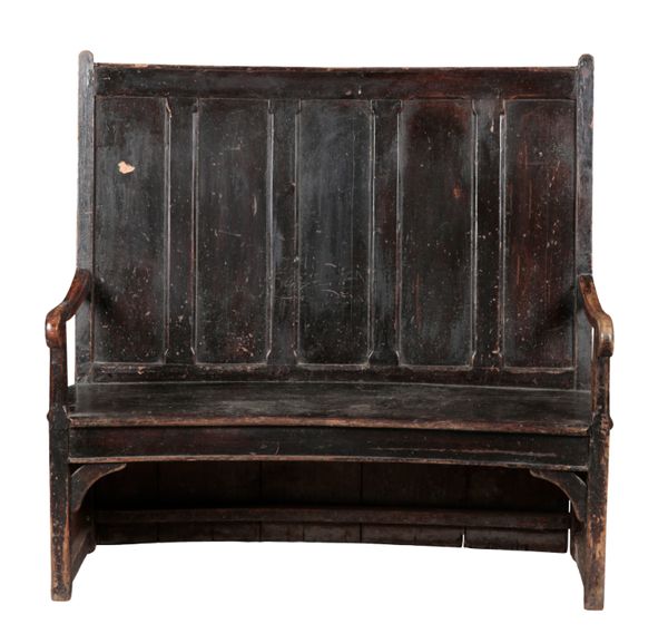 A PROVINCIAL STAINED WOOD BOW-BACK SETTLE