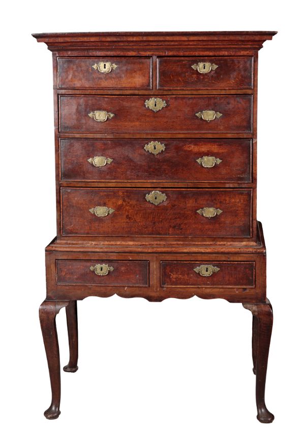 A GEORGE II OAK AND CROSSBANDED CHEST ON STAND