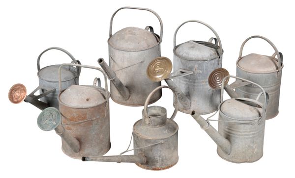 A GROUP OF SEVEN VINTAGE WATERING CANS