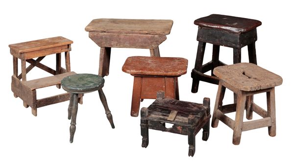 A GROUP OF SIX RUSTIC VERNACULAR STOOLS