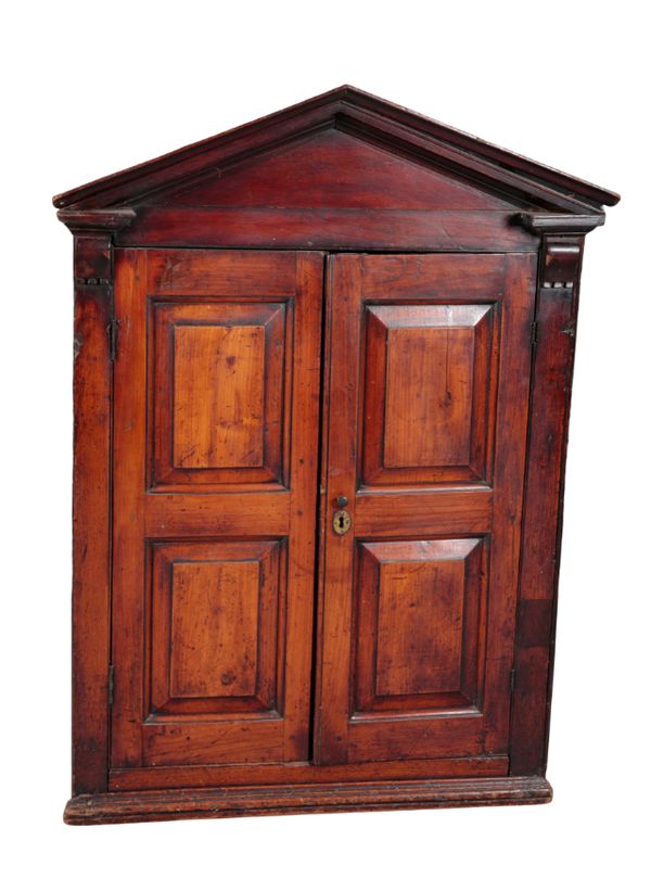 A STAINED WOOD HANGING CORNER CUPBOARD