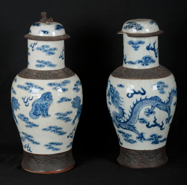 A PAIR OF CHINESE 'CRACKLEWARE' BLUE AND WHITE PORCELAIN VASES AND COVERS