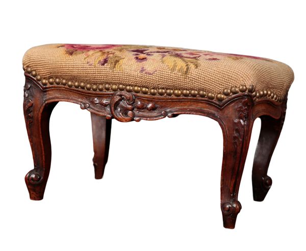 A FRENCH CARVED OAK FOOTSTOOL