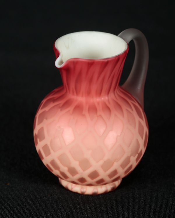 A CASED ART GLASS MINIATURE JUG