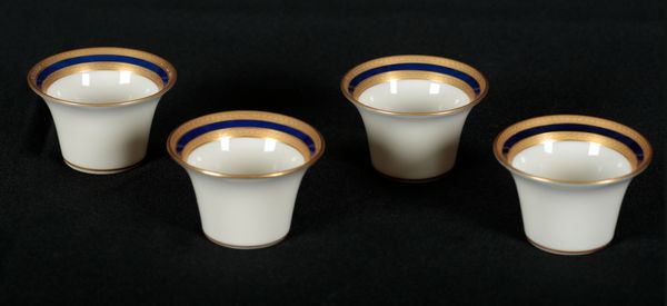 A SET OF FOUR CYLINDRICAL PORCELAIN DISHES BY LENOX, RETAILED BY TIFFANY AND CO