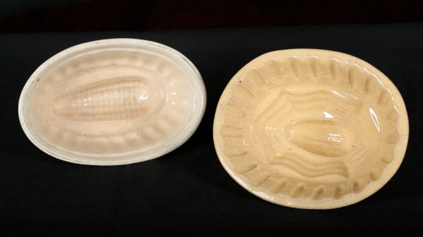 TWO AMERICAN BUFF GLAZED POTTERY JELLY MOULDS