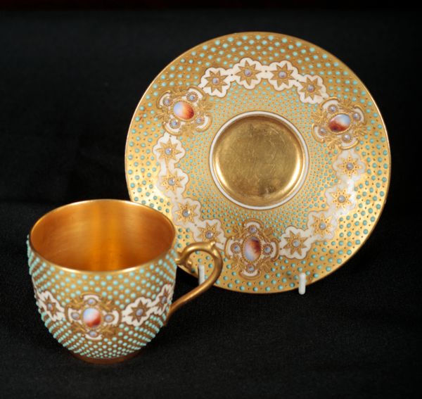 A COALPORT JEWELLED BONE CHINA CABINET CUP AND SAUCER