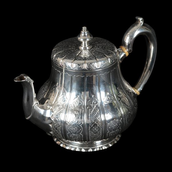 A VICTORIAN SILVER TEAPOT AND MATCHING CREAM JUG