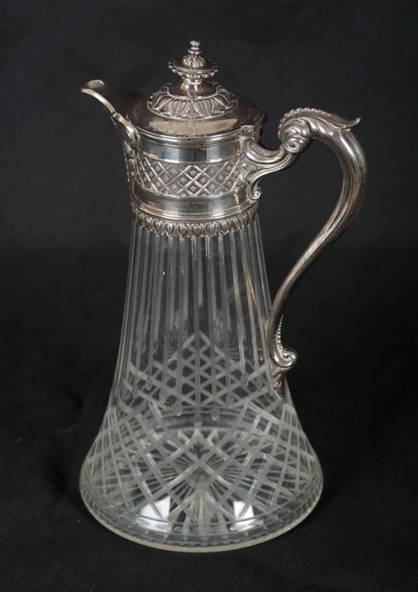 A VICTORIAN SILVER MOUNTED CUT GLASS CLARET JUG