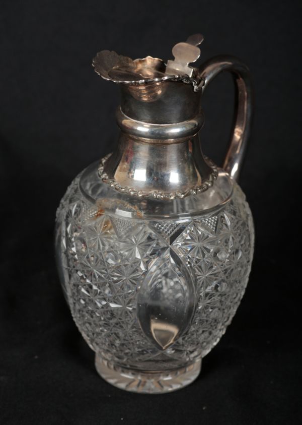 AN EDWARD VII SILVER MOUNTED CLARET JUG