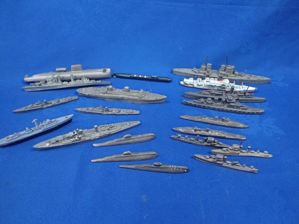 A COLLECTION OF CAST METAL BATTLESHIPS