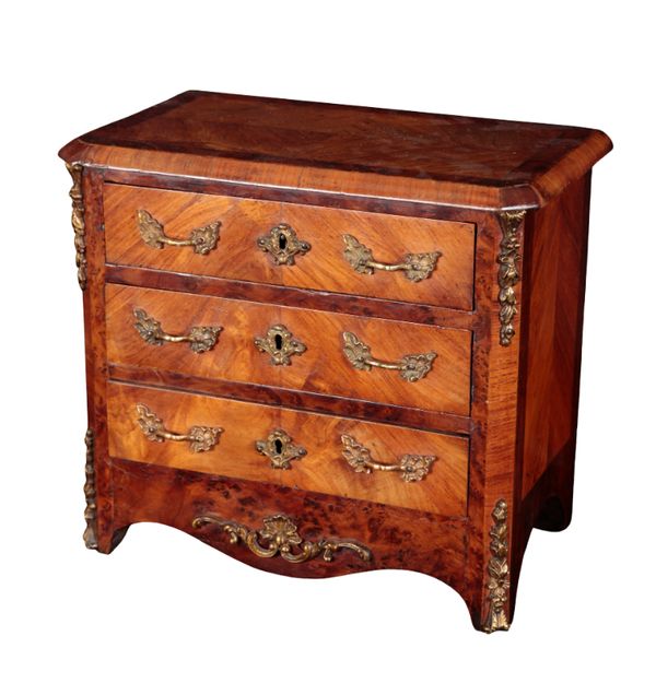 A 19TH CENTURY KINGWOOD AND AMBOYNA BANDED MINIATURE CHEST OF DRAWERS