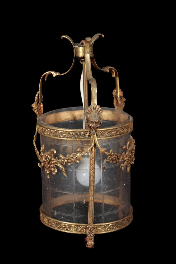 AN ORMOLU AND CUT GLASS CYLINDRICAL HALL LANTERN