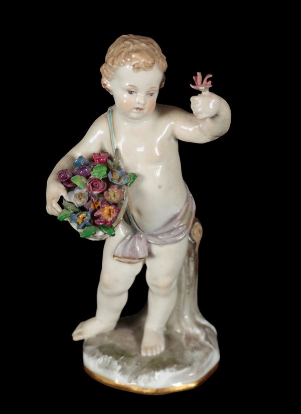 A 19TH CENTURY MEISSEN PORCELAIN FIGURE - STANDING PUTTO