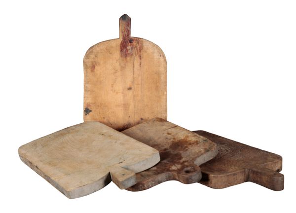 A GROUP OF FOUR RUSTIC BREAD OR CHOPPING BOARDS