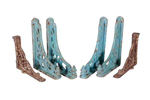 A SET OF FOUR BLUE-PAINTED CAST IRON WALL BRACKETS