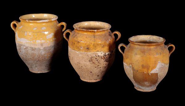 A GROUP OF THREE GRADUATED TERRACOTTA VASES