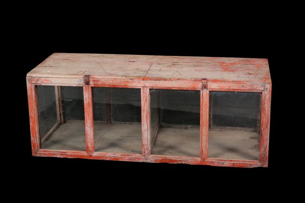 A RED-PAINTED AND GLAZED TABLE TOP DISPLAY CABINET