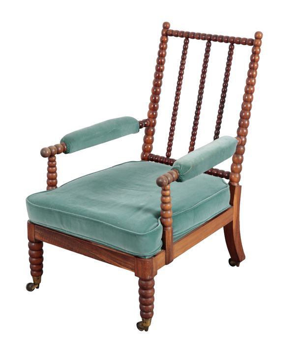 A VICTORIAN ROSEWOOD BOBBIN TURNED ARMCHAIR IN THE MANNER OF MILES & EDWARDS