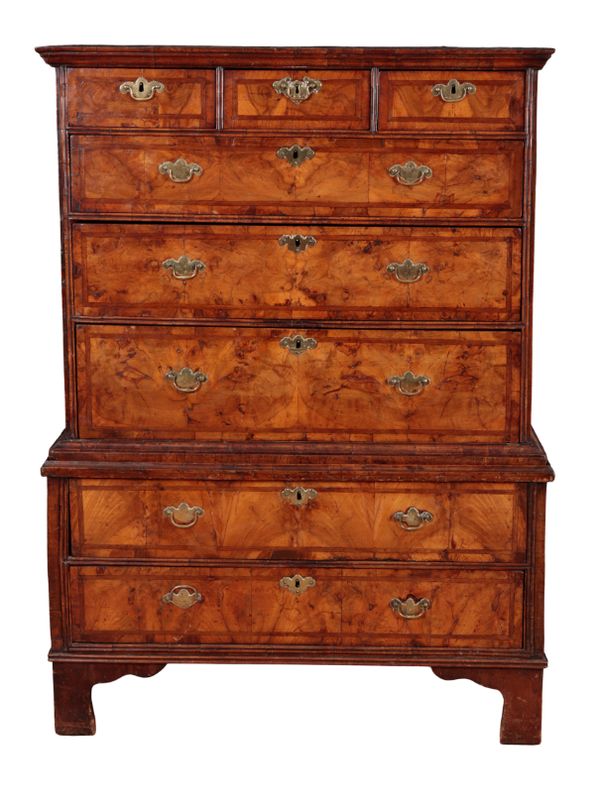 A WILLIAM AND MARY FIGURED WALNUT CHEST ON CHEST