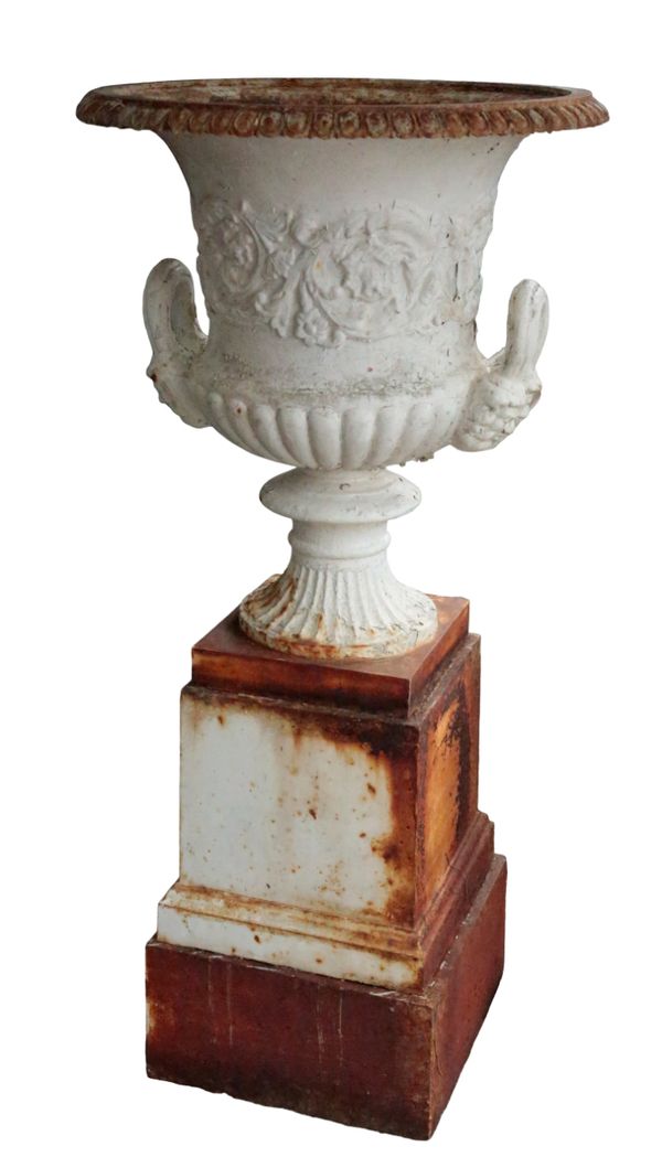 A VICTORIAN WHITE PAINTED CAST IRON TWO HANDLED CAMPANA URN, ON STEPPED PLINTH