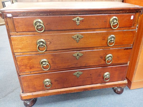 A FOUR DRAWER CHEST OF DRAWERS WITH LARGE BRASS RING HANDLES