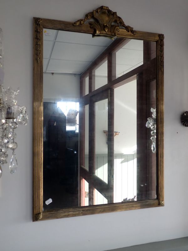 A GILT BRASS FRAMED MIRROR